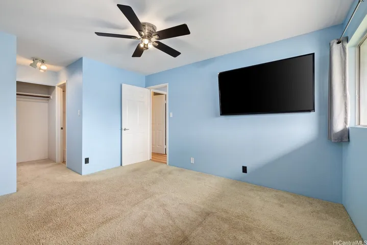 Bedroom has direct access to bathroom from dressing area closets.  (TV no included)