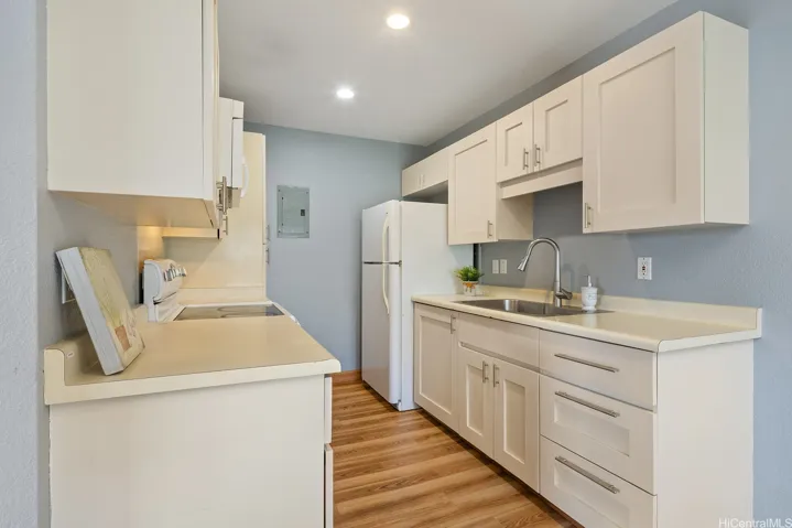 Clean and efficient kitchen.  Large stainless steel sink.