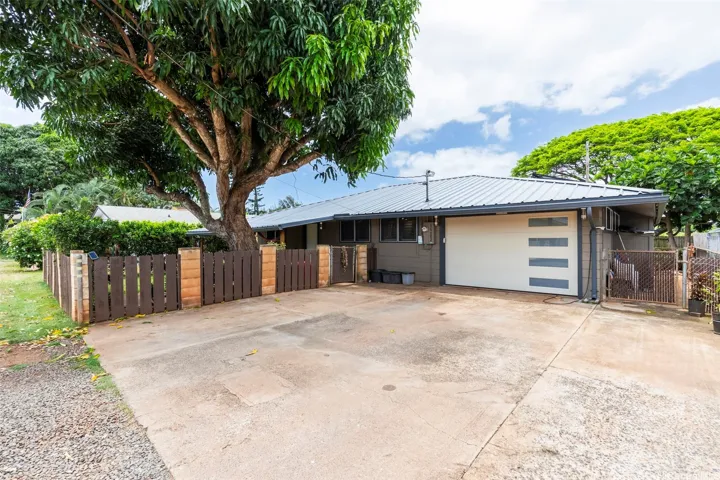 Fresh paint, new garage door and new metal roof