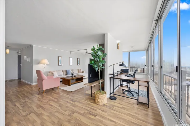 Enclosed lanai extends the living area, offering flexible space for work, relaxation, or hobbies.