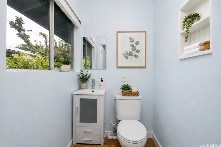 Enhanced: unpermitted half bath off the primary suite