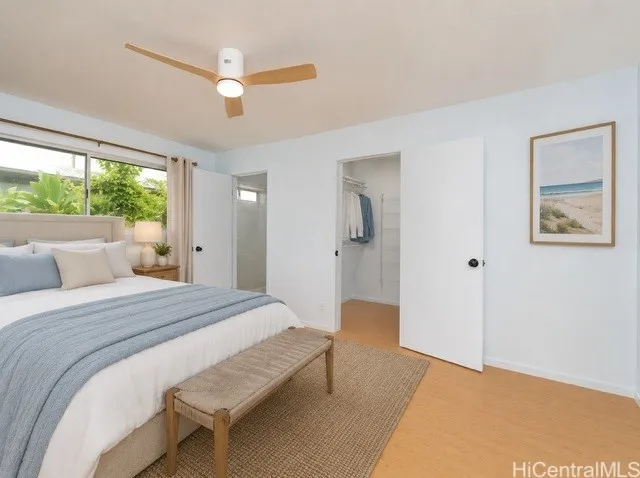 Enhanced Primary bedroom: retreat to the spacious primary suite featuring beautiful bamboo flooring and updated ceiling fan & smooth ceilings with the popcorn removed.  Ample storage with two closets including a Walk-in and an unpermitted half bath.