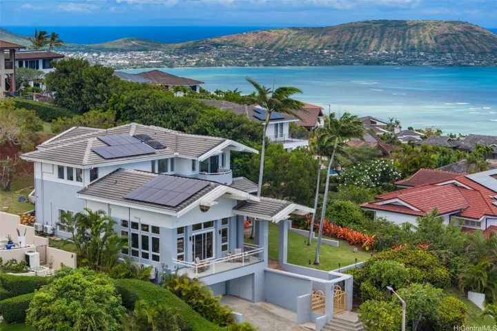 Beautiful architectural design includes many windows to capture the breeze, light, and view, and several balconies and lanais for indoor/outdoor living.