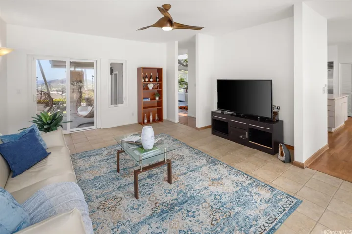 The entertainment room opens towards the side patio and view.