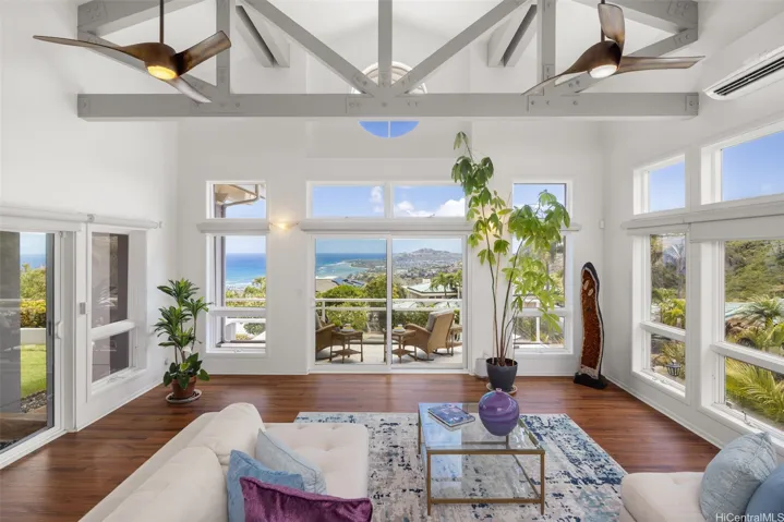 Striking views of ocean, Diamond Head and greenery are on display in this beautiful home.