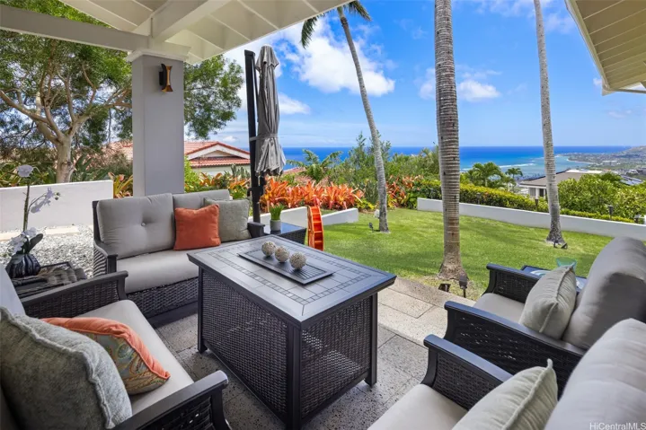 This covered patio is a perfect place to relax or dine.  There is also a permit for a pool that you can build in the grassy area!
