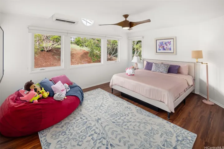 Second upstairs bedroom with lots of windows and split AC. ALL the bedrooms are a good size, with plenty of space for a desk or seating area.