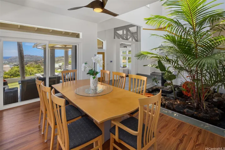 Dining area captures the view and opens to the outdoors as well.