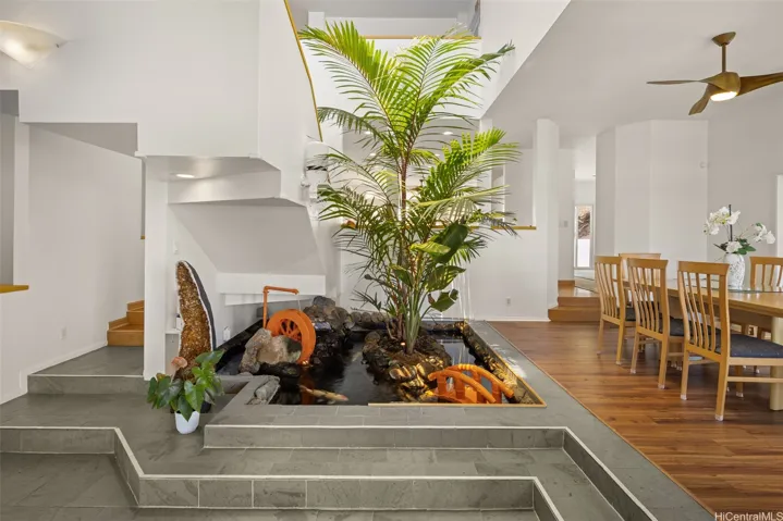 Dramatic entry includes a koi pond.