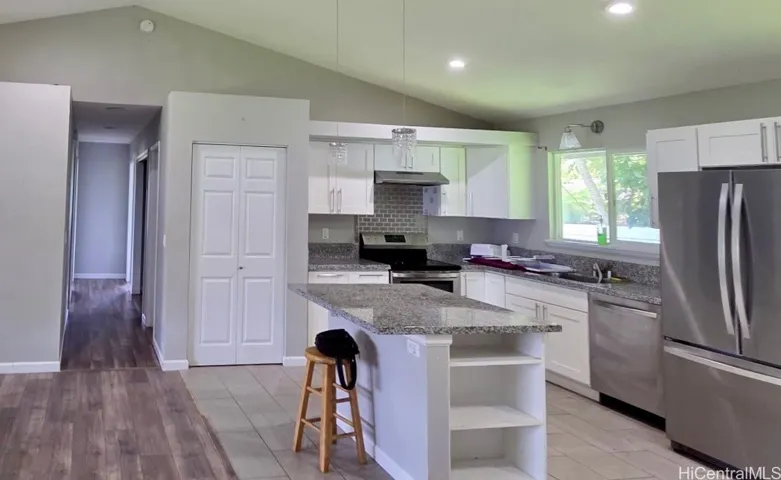 Bright open-concept living area seamlessly connects to the kitchen and dining spaces.
