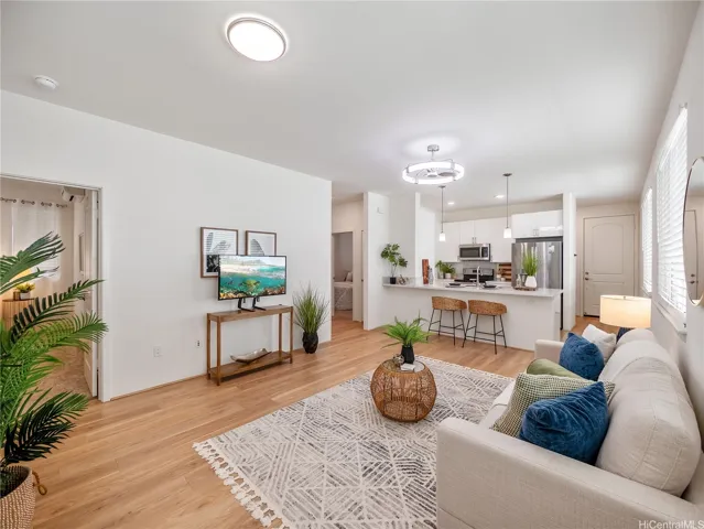 Welcome in!  Looking into the bright, open-concept living area and kitchen of the home.