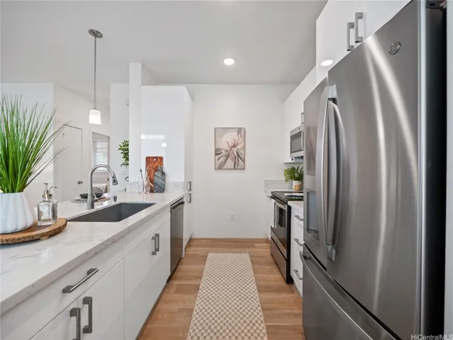 Enjoy this timeless, well appointed kitchen featuring stainless-steel appliances, dishwasher and an oversized single-basin undermount sink with sleek high-arc faucet, modern cabinets.  All appliances are included.