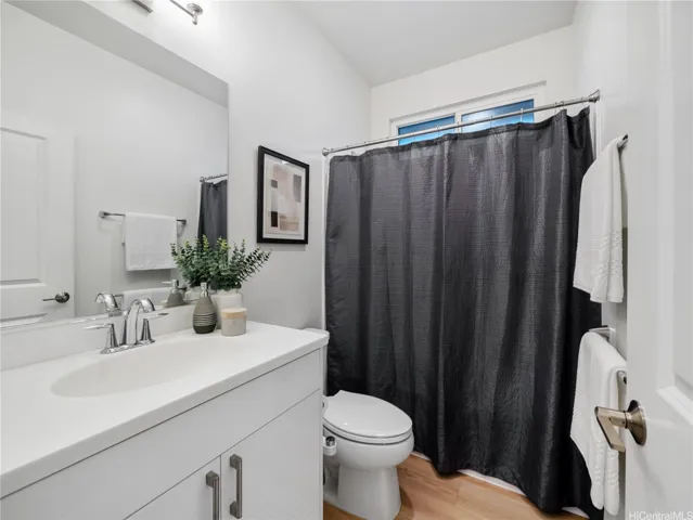 The hall bathroom with a full shower.  Privacy glass window in shower allows for natural light.