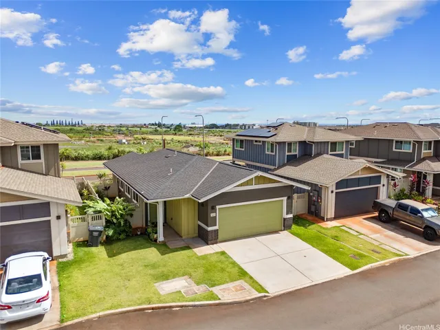 Enclosed garage with driveway parking.