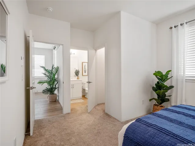 Open door on the right leads to walk-in closet in primary bedroom.