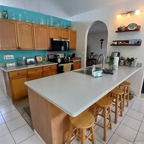 Good size open kitchen with extra counter top seating.