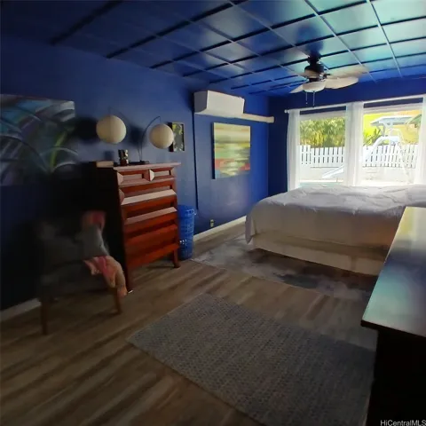 Expanded primary bedroom fits a king sized bed and opens to the pool.