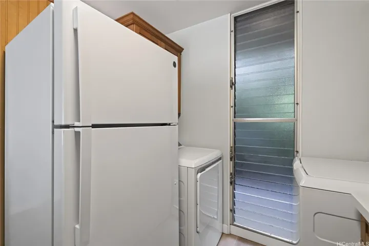 New refrigerator, full-size washer, dryer, and range/oven.