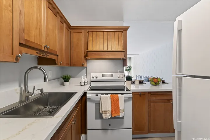 New full-size sink and faucet and range/oven.