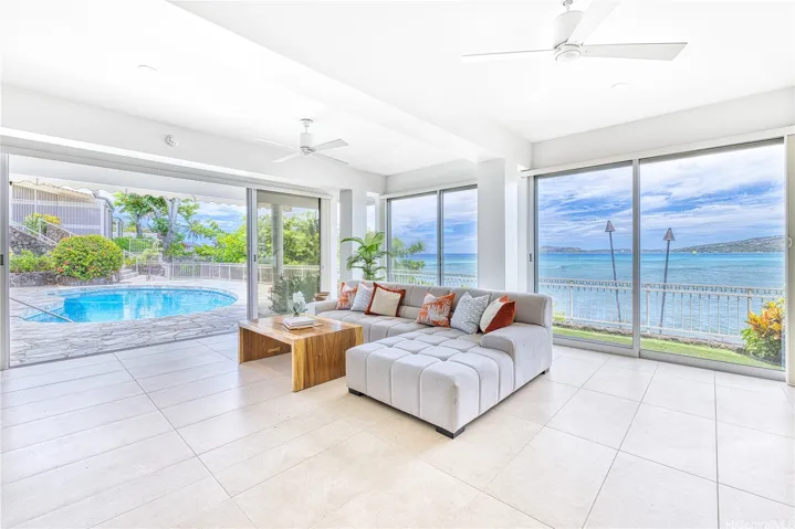 Glass pool room and heated pool.