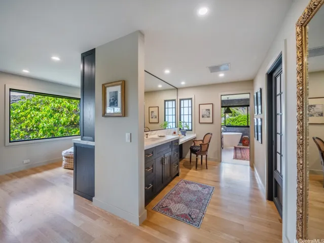 A sense of design between the primary and the bath, closet Is here to with its own washer and dryer inside. There is also a main laundry room down stairs.