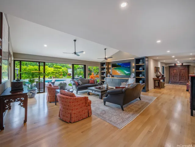 The family room with side kitchenette is convenient for entertaining with its own dishwasher and refrigerator.