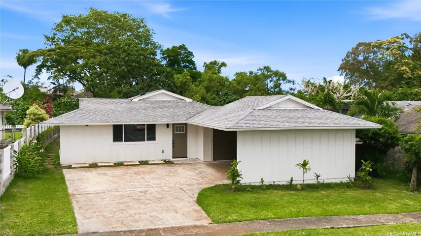 Designed for gatherings, this home offers a generous driveway, two-car carport, and abundant street parking.