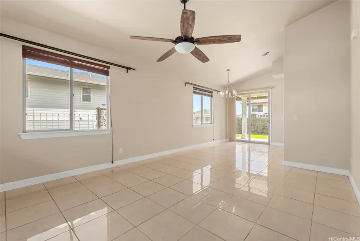 Spacious living room with open flow to dining area