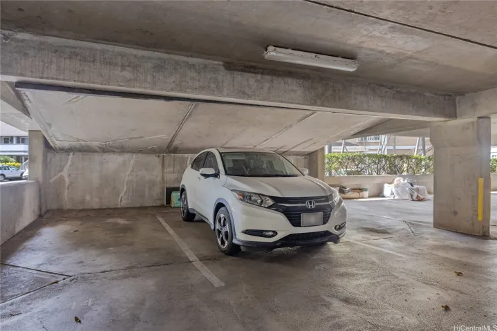 Covered Stall where White SUV is parked