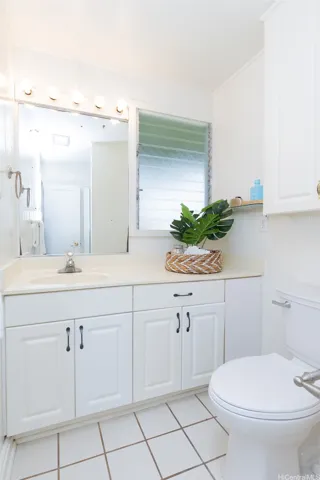 There are two full bathrooms on the left wing of the home amongst the three bedrooms.
