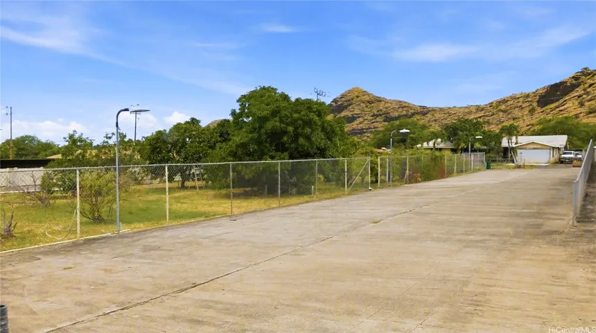 Tons of parking for a boat, work vehicles, heaving equipment, machinery, storage container, and cars!