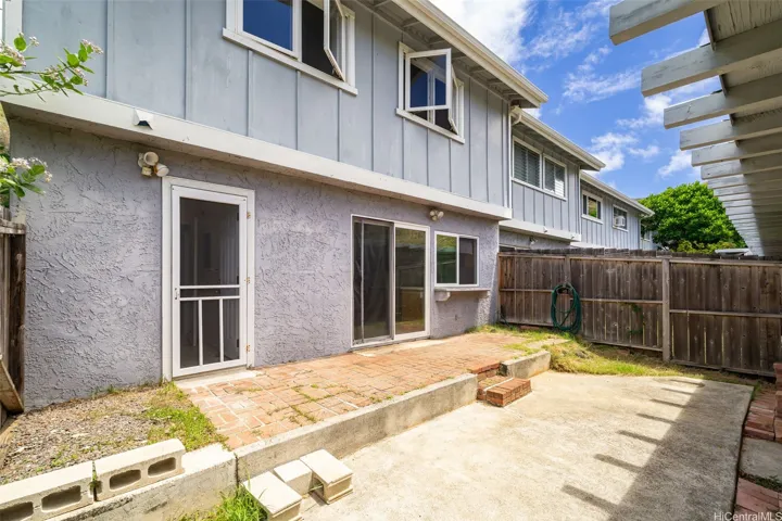 The courtyard is between the carport and the kitchen.