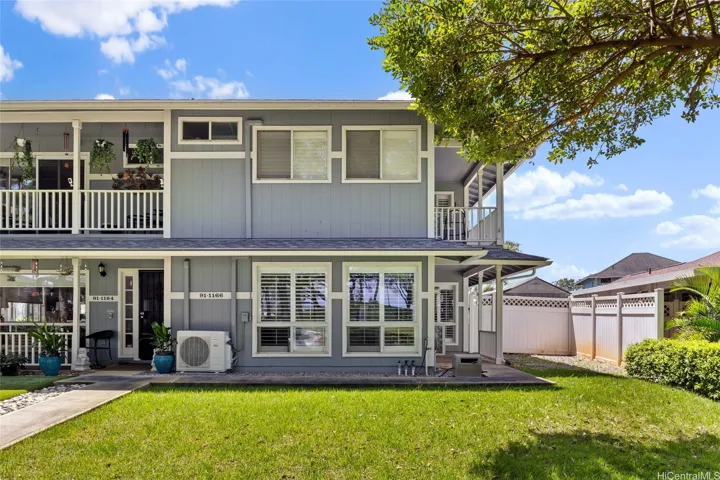 Front of home. Primary room upstairs Bedroom with Lanai. Enjoy the curb appeal, fresh paint, new roof and easy parking. There is a park in the front of this beautiful home.