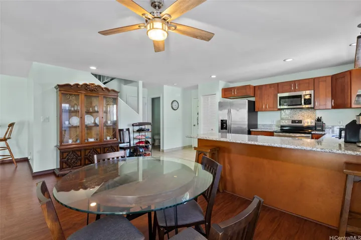 Dining area with easy open access to the kitchen. Open concepts are ideal for groups and perfect for entertaining. Ample storage and a door to the garage. Half Bath found here!