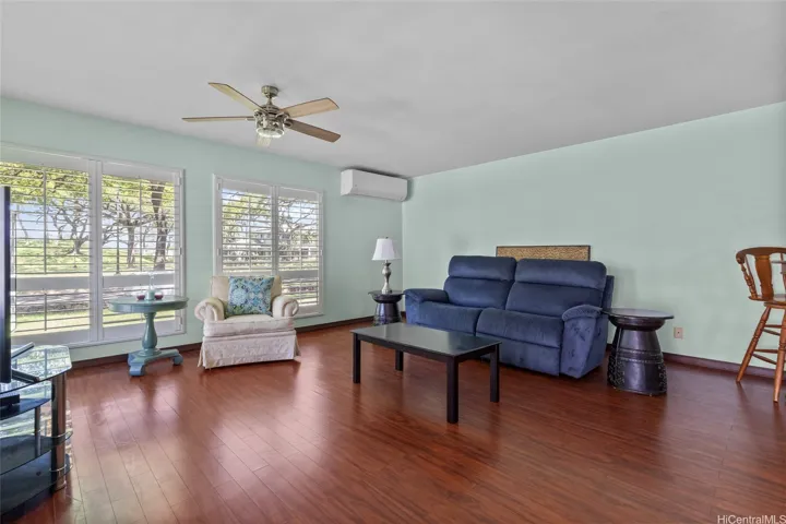 Open space with natural light flowing in. Front windows facing the garden park and well kept grounds. Split AC and cooling ceiling fan.