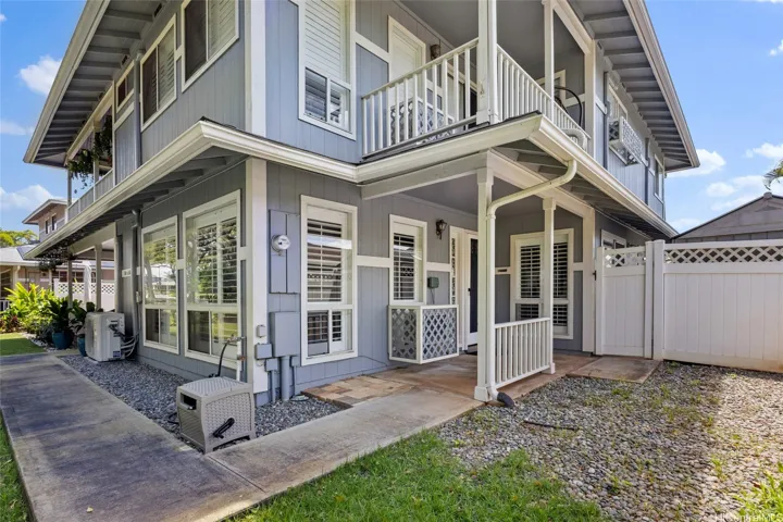 Two Floors, Two Lanai, Gated area and 2 car garage in back. Freshly painted home with a new roof, private yard and garden views.