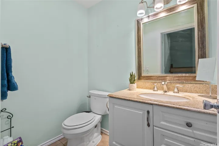 2 and 1/2 restrooms located in this home. Bright half bathroom located on the first floor. Brightly lit with great lighting and functional countertop space. Strong  vanity to store and organize your toiletries and supplies.