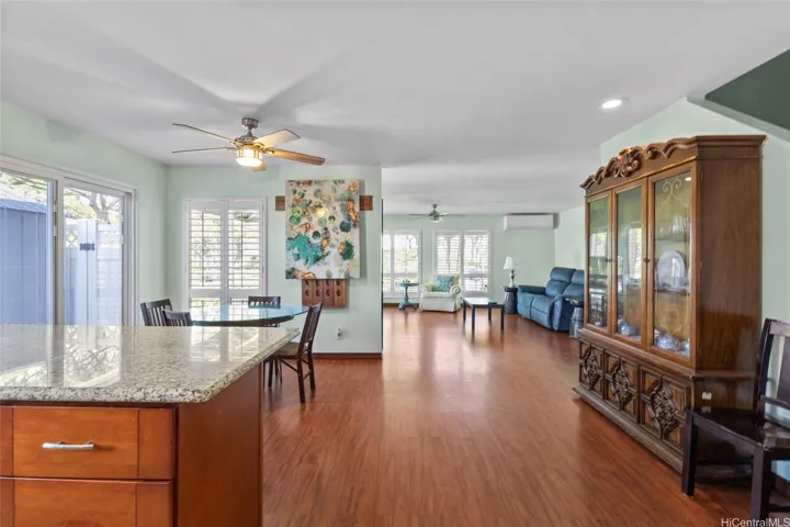 Open concept allows the family to enjoy more time together. As you enter the garage, you're greeted with this open space on the first floor level. Easy to clean attractive floors.  Garden front with trees and benches. Enjoy the cooling Split Air Conditioning and remote controlled ceiling fans.