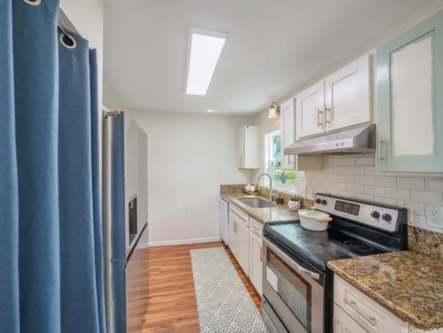 Kitchen window faces the park and mountain views