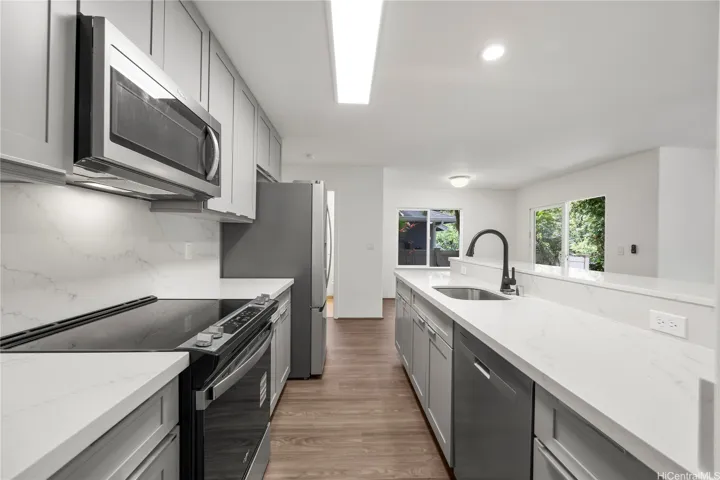 Open kitchen area with counter top seating