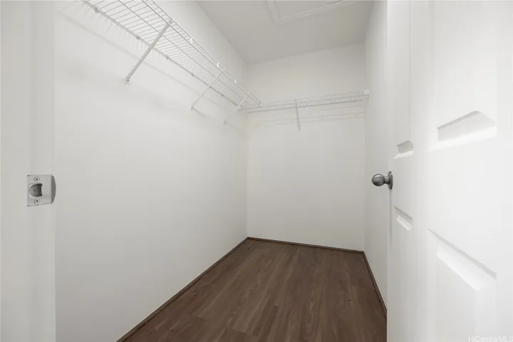 Primary bedroom walk in closet