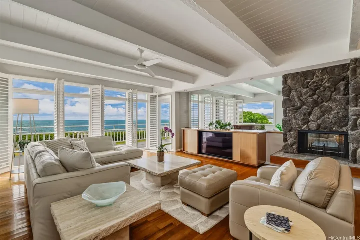Double-sided fireplace separates the family and living rooms.