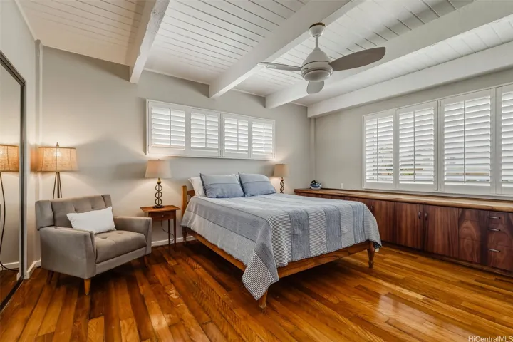 Bedroom 1 on main living level w/custom Koa built-ins.