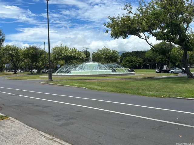 Go down Kalakaua Ave and Diamond Head Ambassador is across the street from this fountain.