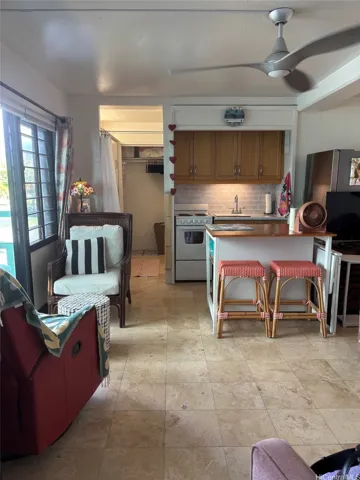 Cozy kitchen space with full size refrigerator.