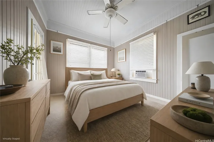 Primary suite in 207 Concordia has great natural light and a door leading to the covered front porch.