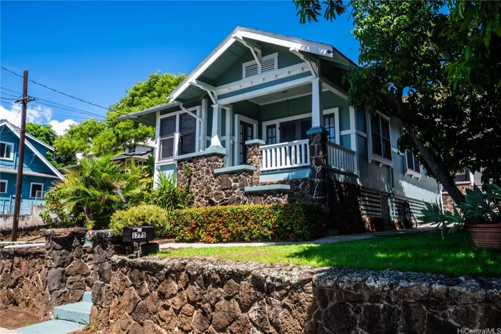 Lava rock retaining walls and the distinctive Craftsman style greets you at the steps of historic 1775 Lusitania, built in 1922.