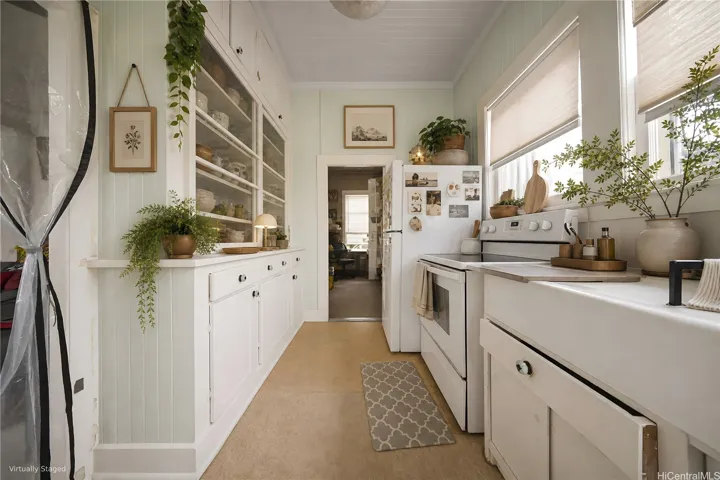 The kitchen of 207 Concordia, looking towards the office area.