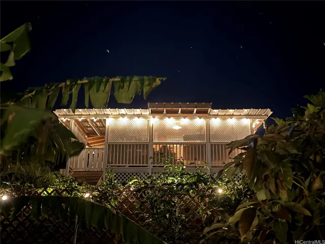 MAIN REST STRUCTURE AT NIGHT OVERLOOKING THE CITY LIGHT FROM AFAR