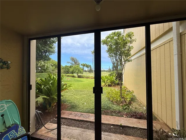 Lanai with golf course view in bedroom.